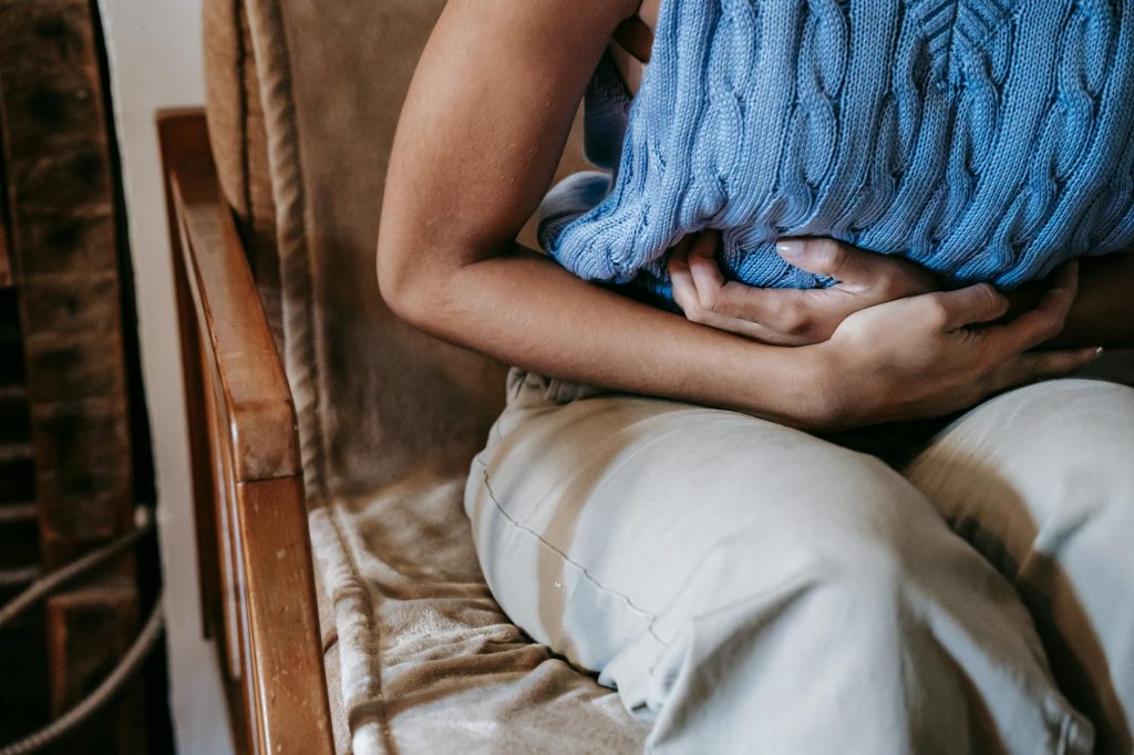 Woman suffering from a stomach pain