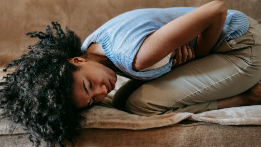 woman suffering from a stomach pain